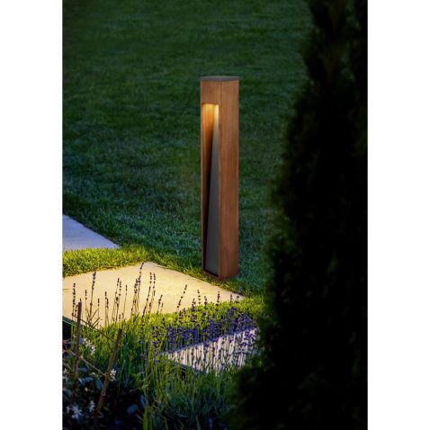 marble path of square tiles illuminated by a lantern made of met