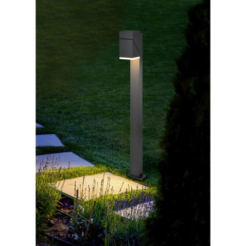 marble path of square tiles illuminated by a lantern made of met