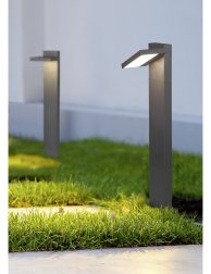 ground lantern lighting marble walkway in the evening park with