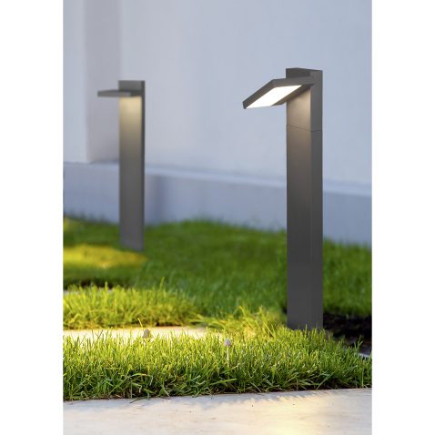 ground lantern lighting marble walkway in the evening park with