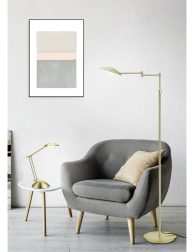 comfortable armchair near coffee table with green plants, lamp a