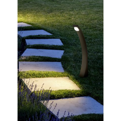 marble path of square tiles illuminated by a lantern glowing wit