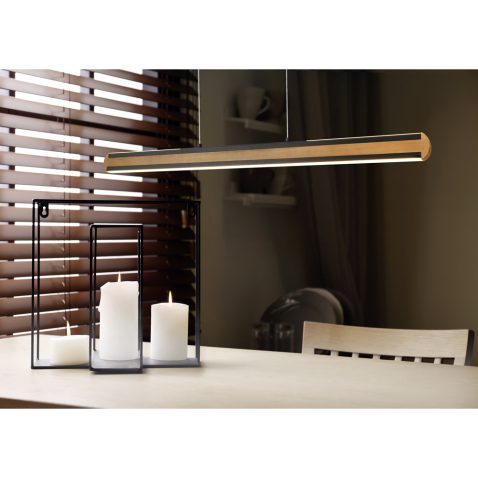 Wooden dining table with candles in room. Interior design