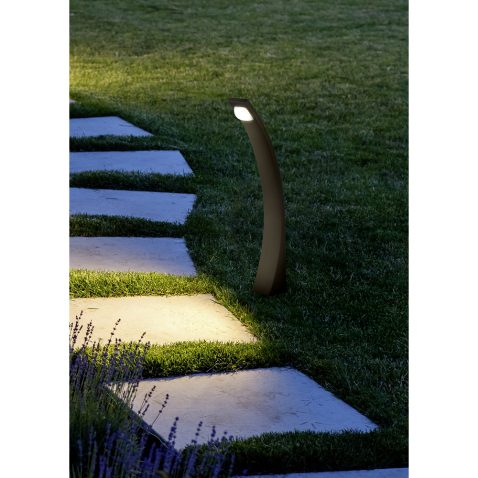 marble path of square tiles illuminated by a lantern glowing wit