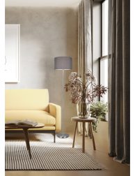 3d render of agrungy concrete room with a yellow sofa an art can