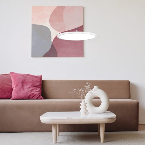 Blank picture frame mockup on white wall. White living room desi