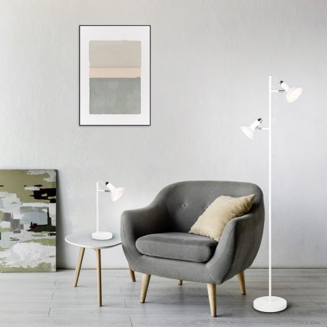 comfortable armchair near coffee table with green plants, lamp a