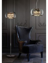 Stylish black chair against a dark gray wall