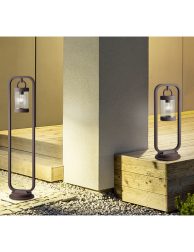 Exterior of illuminated house among green