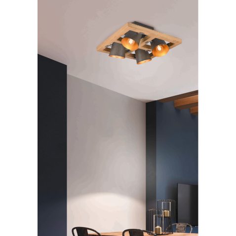 Modern sofa and dining table with iron chairs in the loft interi
