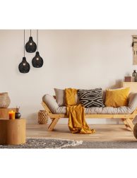Scandinavian sofa with pillows and dark yellow blanket in bright