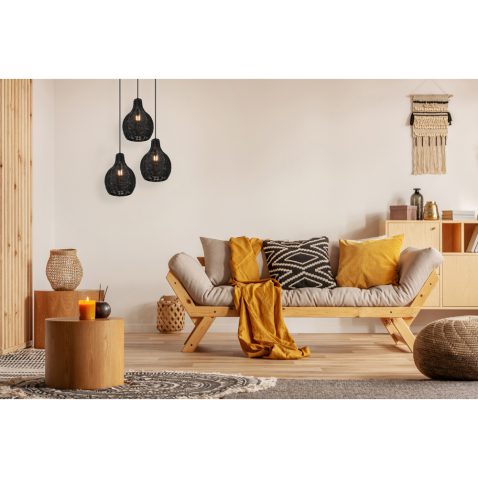 Scandinavian sofa with pillows and dark yellow blanket in bright