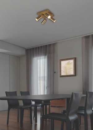 interior view of a modern living room in the  foregorund the modern dining table with its leather chairs, the floor is made of wood